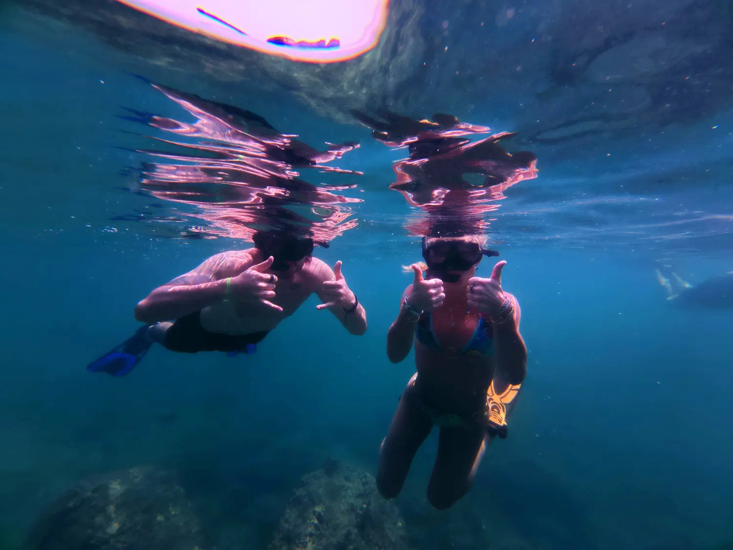Elyse and Gabriel snorkeling underwater